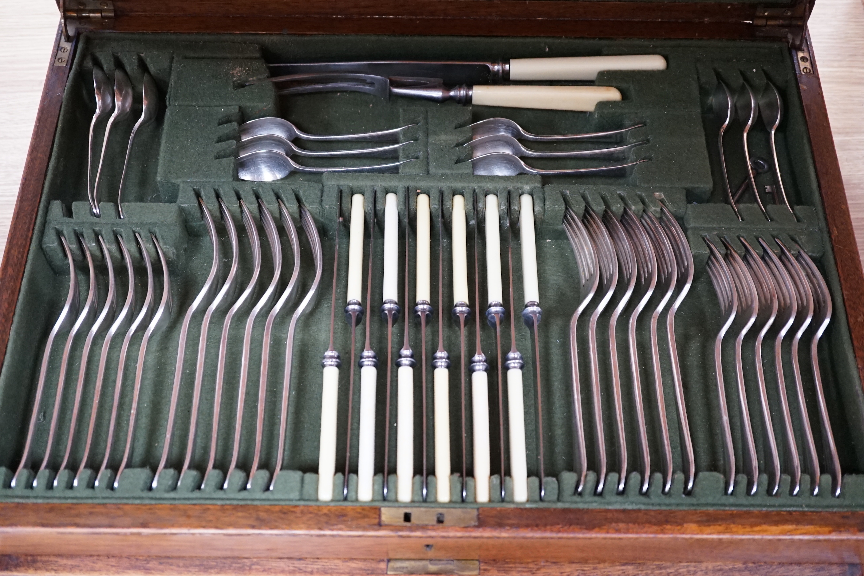 An oak cased canteen of silver plated flatware, 51cm wide